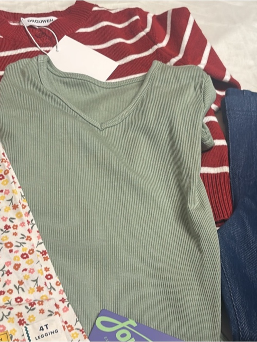 Lots of 4 piece Kids' clothes two pants,sweater and blouse.